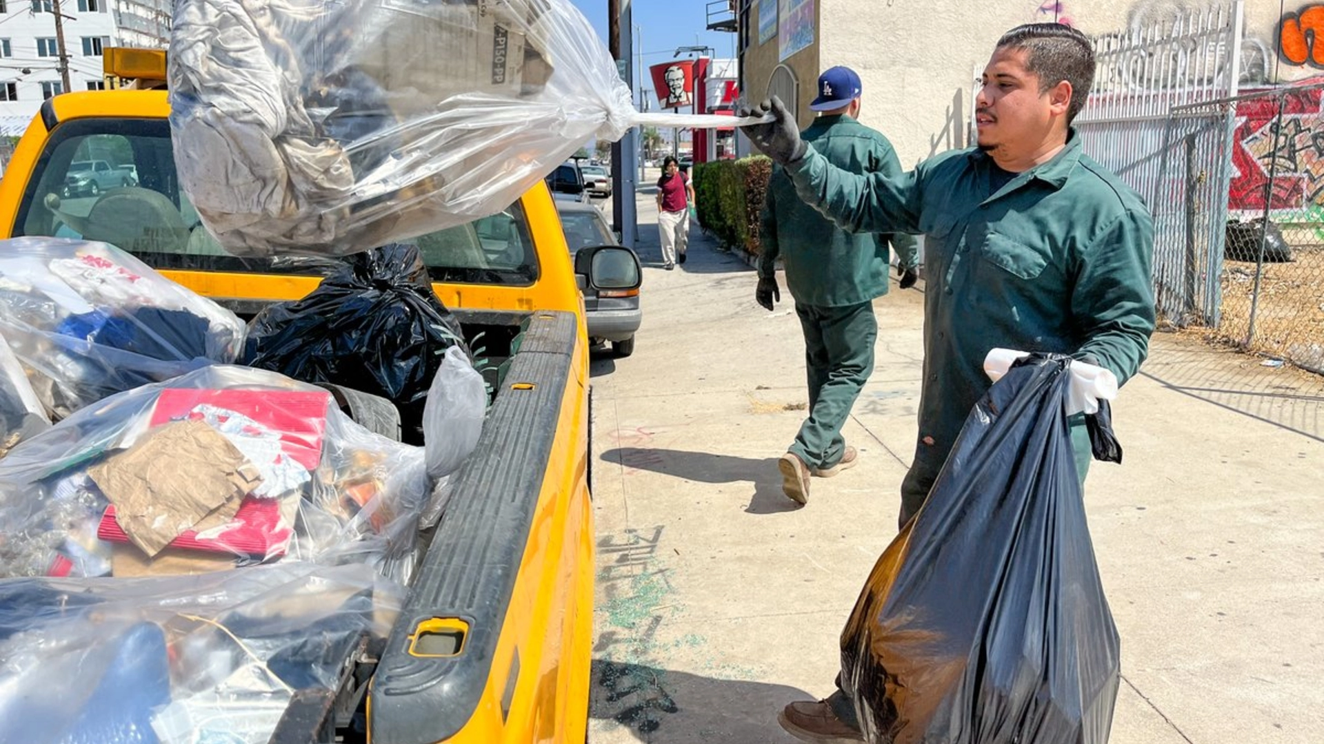 City worker throwing away trash